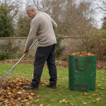 Raking fallen leaves into The Windrow Sack