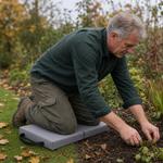 Kneeling on the pad while working at the edge of a garden bed