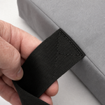 Close up of the black webbing carry handle and its reinforced stitching