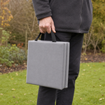 The pad folded and carried by both webbing handles